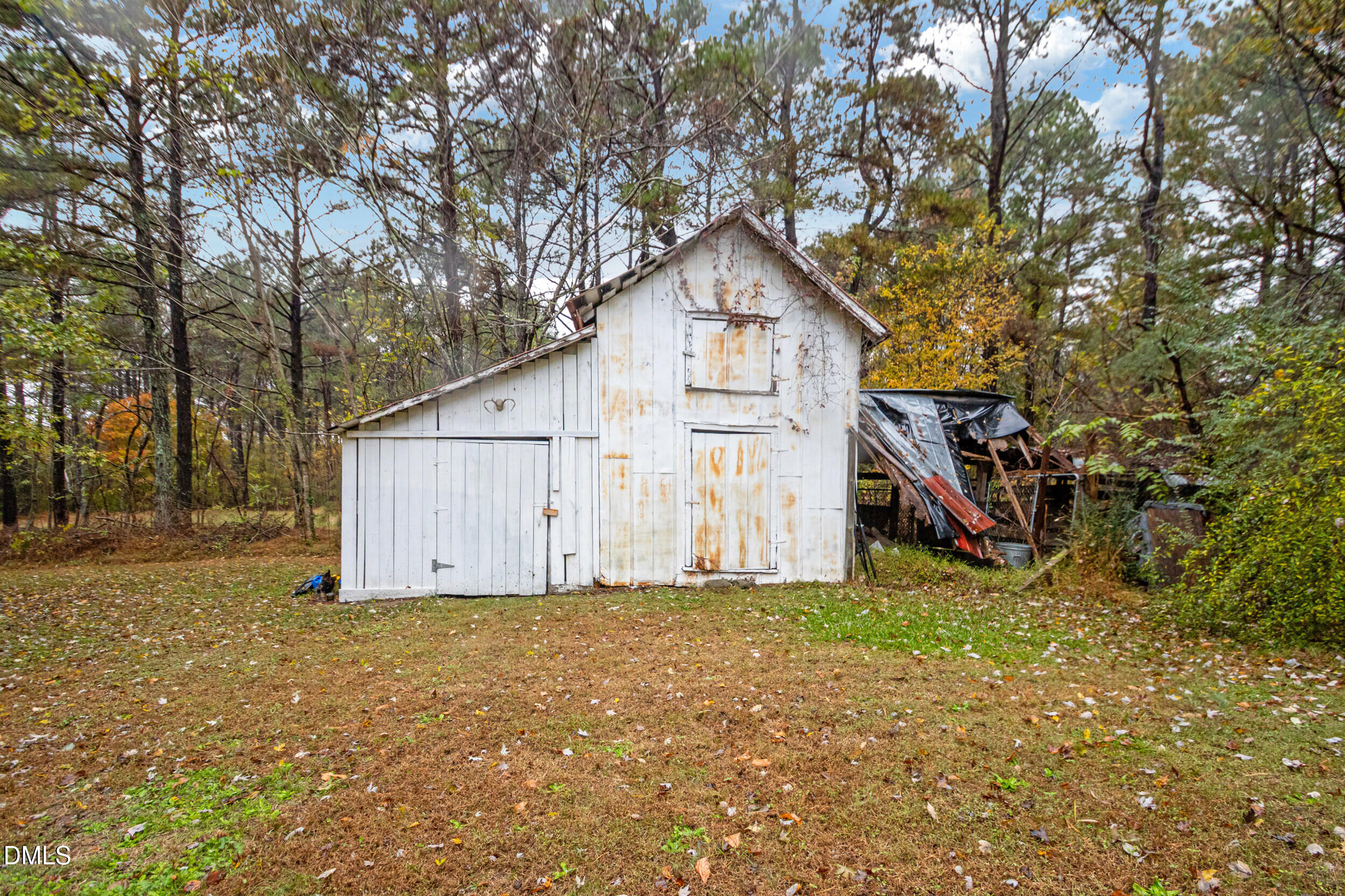 1734 Rocky Ford Road Henderson, NC 27537 - Photo 32 of 44 a view of a house with a yard
