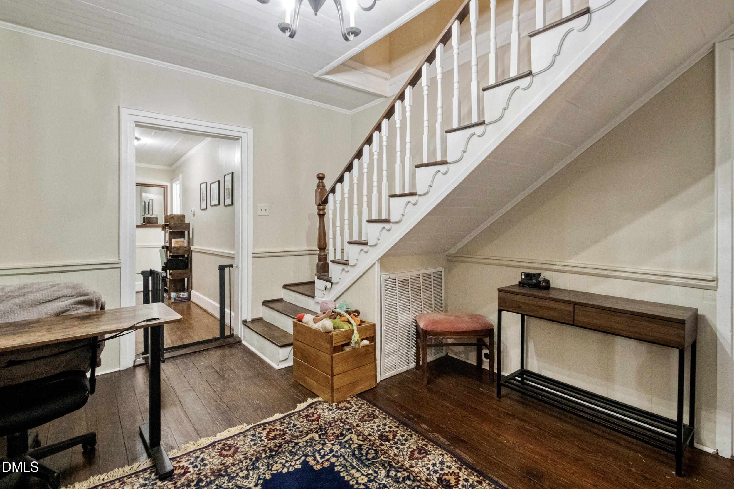 1734 Rocky Ford Road Henderson, NC 27537 - Photo 3 of 44 a living room with wooden floor and a ceiling fan