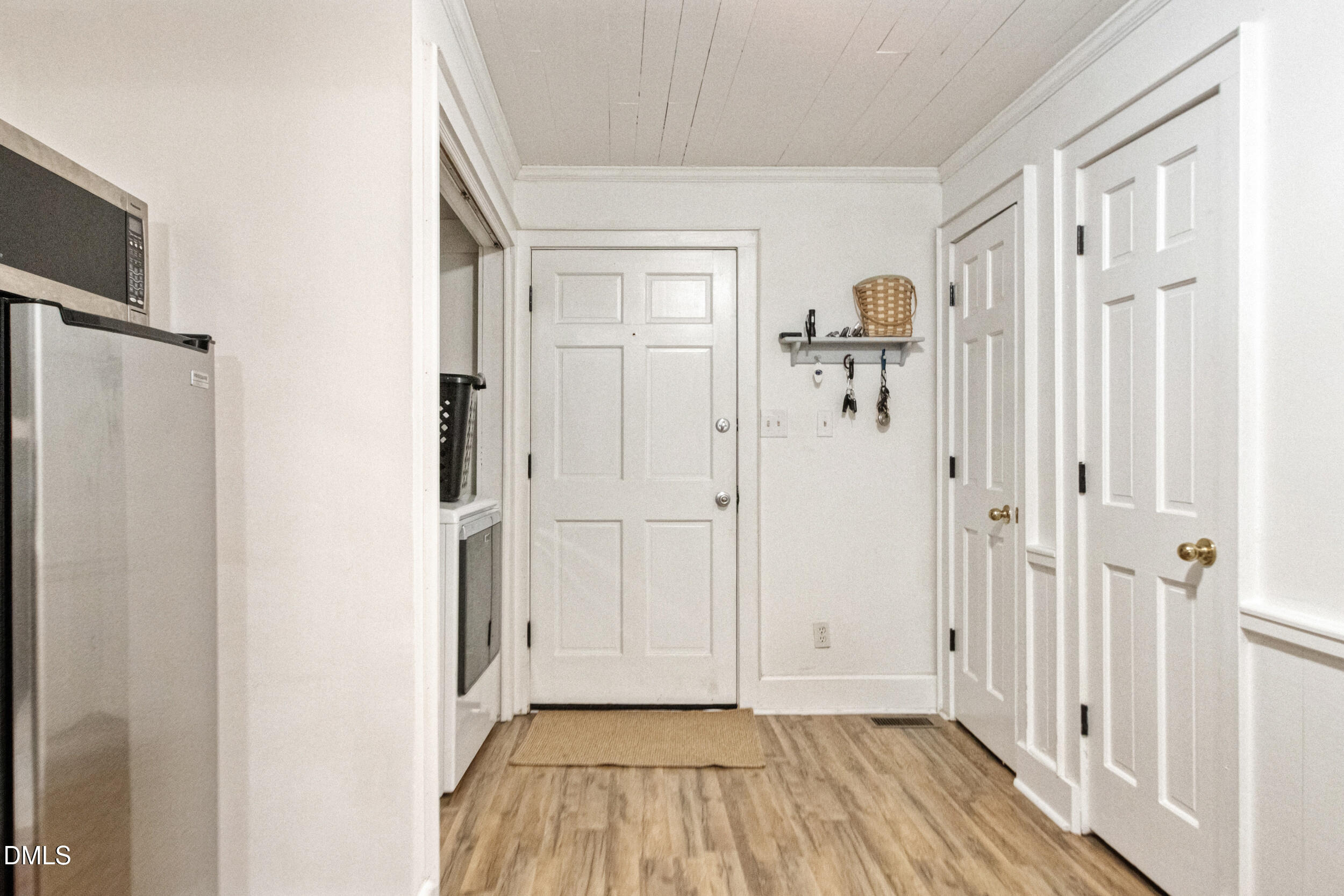 1734 Rocky Ford Road Henderson, NC 27537 - Photo 7 of 44 a view of a hallway with wooden floor and entryway