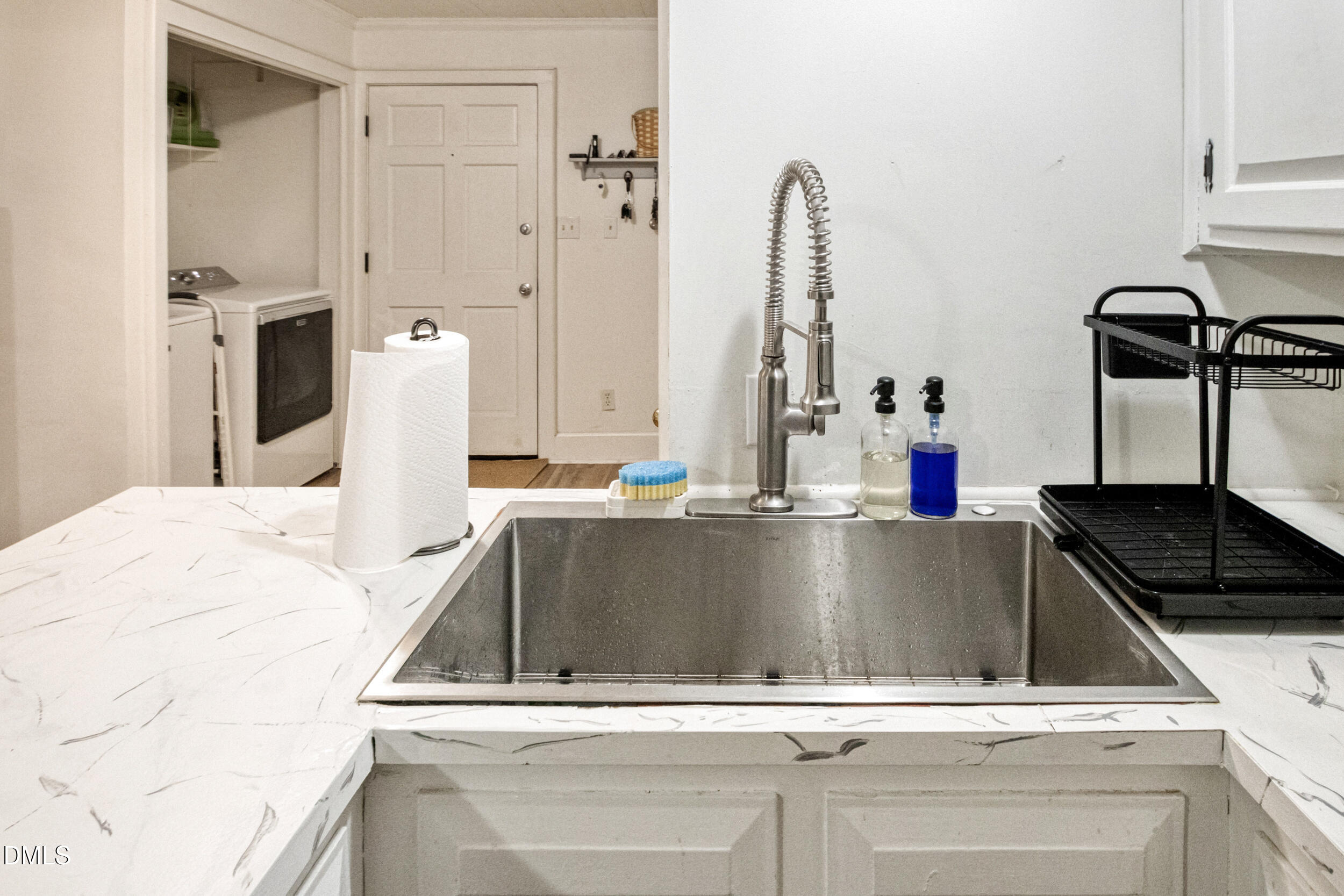 1734 Rocky Ford Road Henderson, NC 27537 - Photo 9 of 44 a close view of sink and tap
