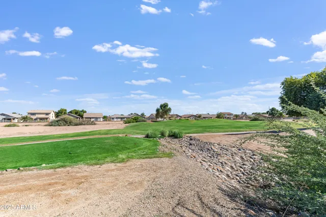 a view of a golf course with a house