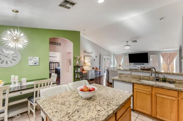 a kitchen with a stove a sink and a refrigerator