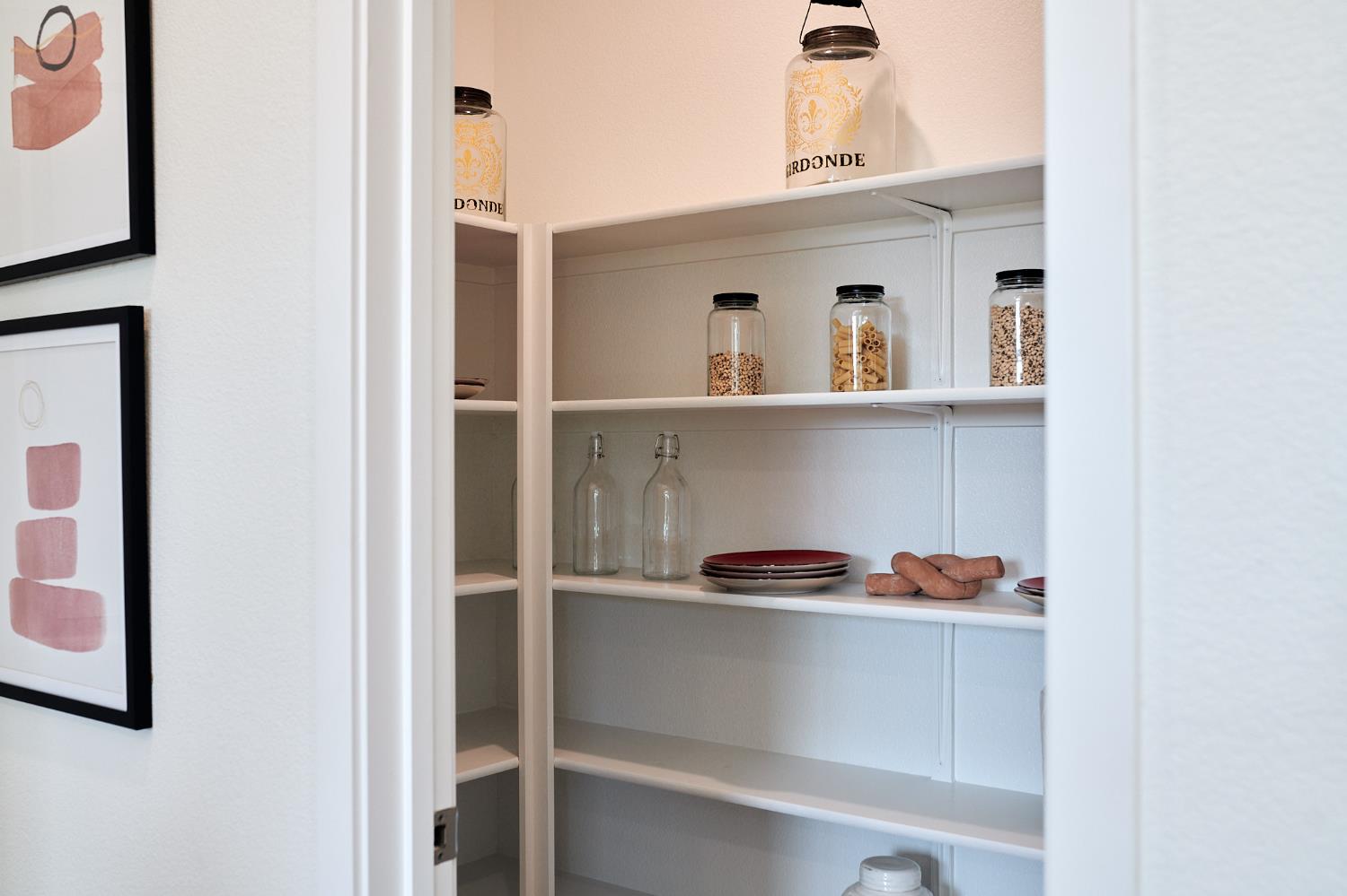 4727 Ariel Street Keyes, CA 95328 - Photo 12 of 22 a shelf with cup and plates