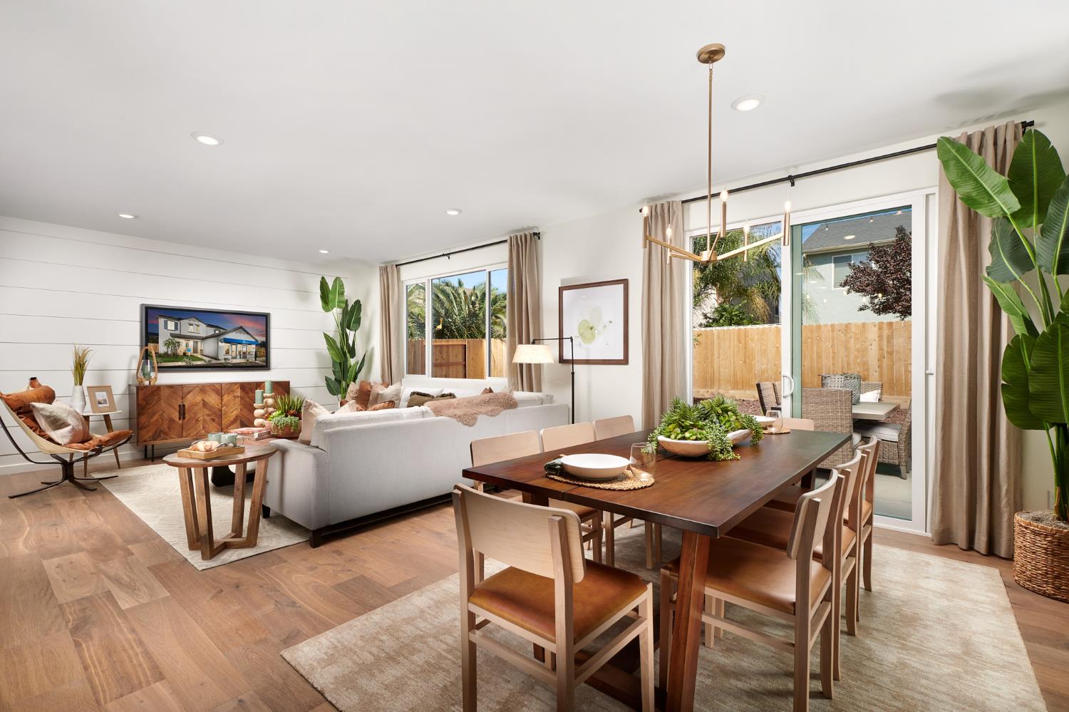 4727 Ariel Street Keyes, CA 95328 - Photo 5 of 22 a view of a dining room with furniture wooden floor and a chandelier