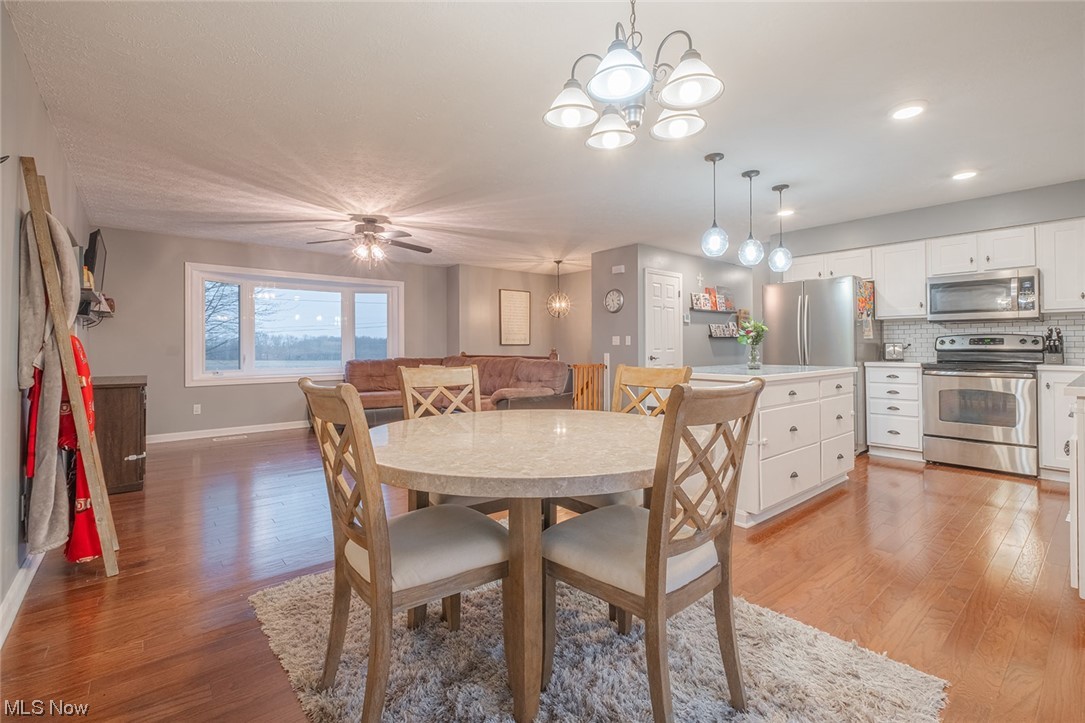 4179 Blake Road Seville, OH 44273 - Photo 6 of 29 Eat-in kitchen, open concept, engineered HW flooring.
