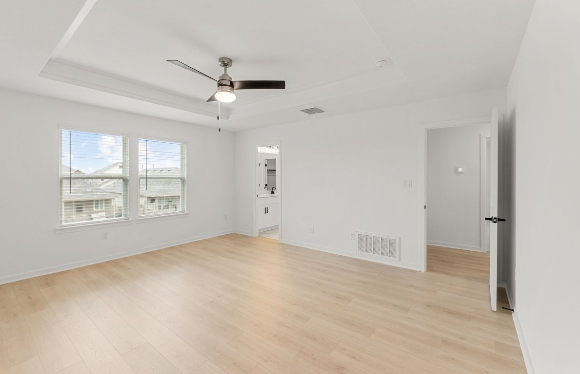 360 Begonia Street Buda, TX 78610 - Photo 11 of 26 a view of an empty room with a window