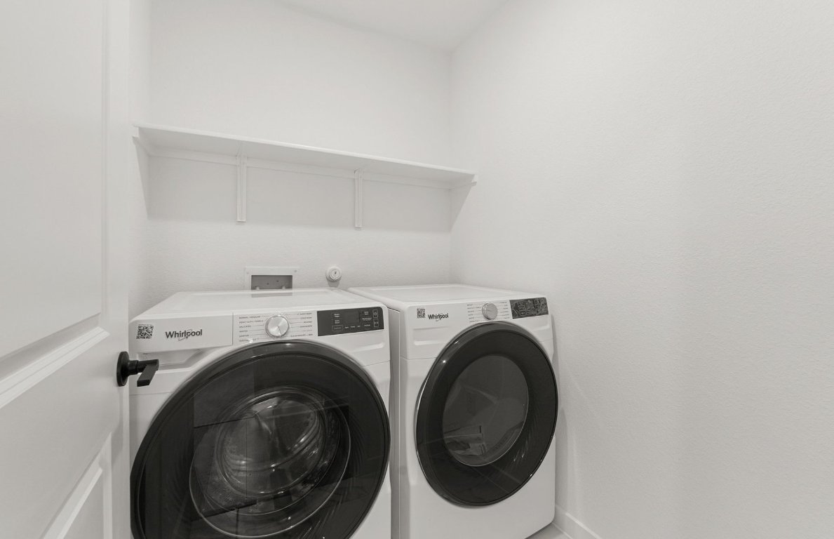 360 Begonia Street Buda, TX 78610 - Photo 21 of 26 a utility room with dryer and washer