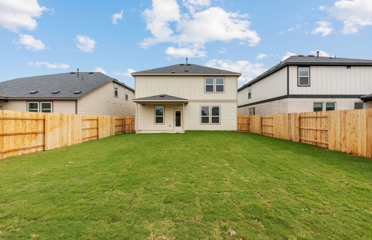 360 Begonia Street Buda, TX 78610 - Photo 22 of 26 a front view of a house with a yard