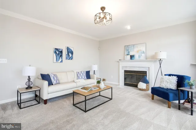 a view of a house with a yard and sitting area