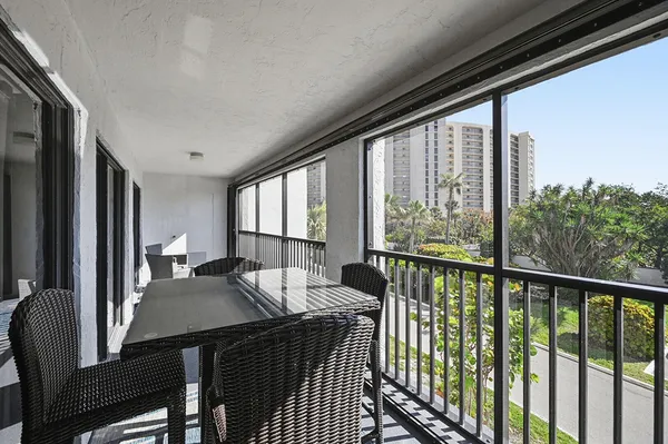 a view of balcony with furniture