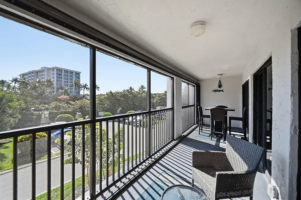 a swimming pool with outdoor seating and yard