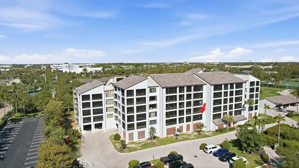 an aerial view of a houses with a lake view