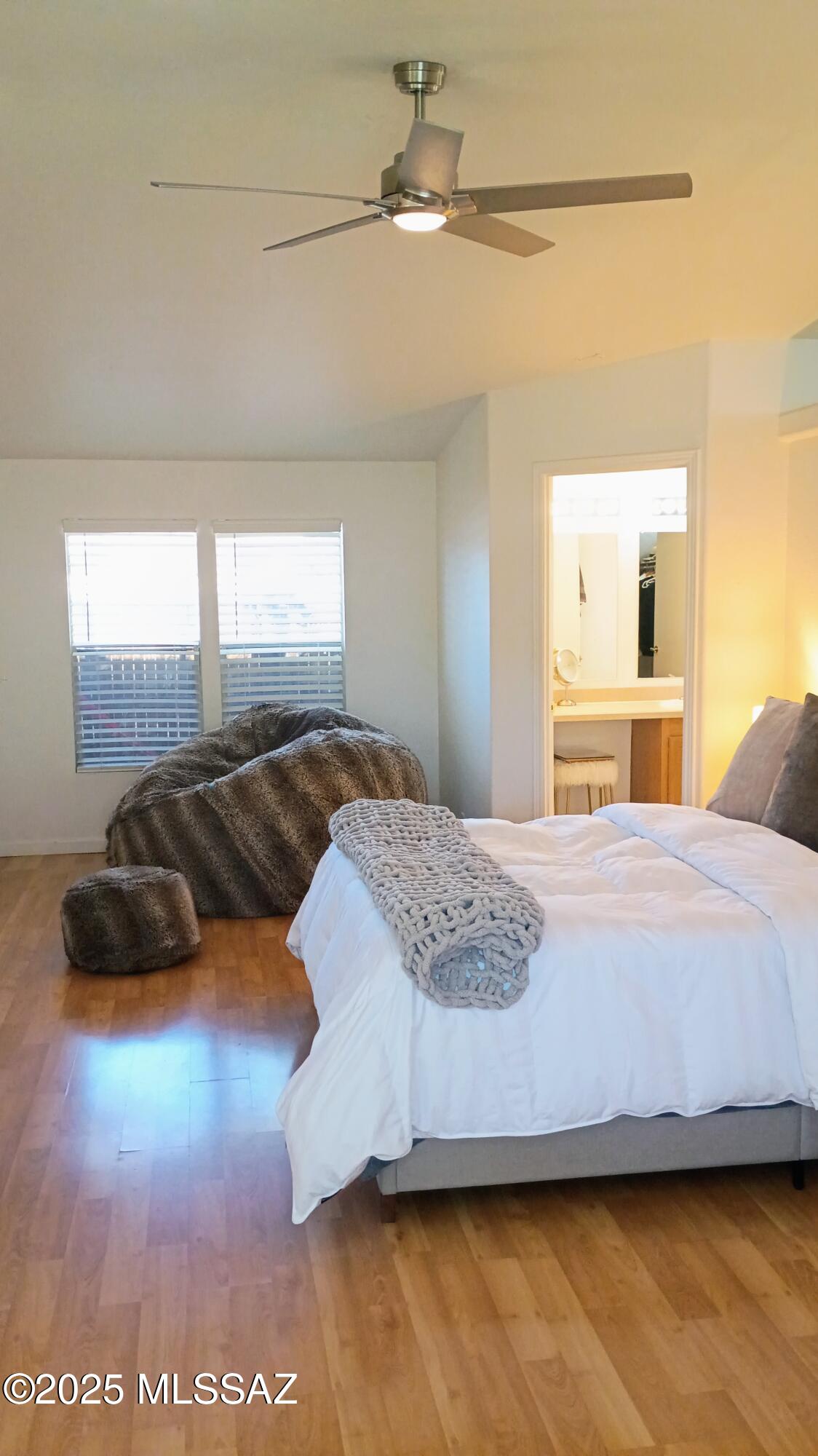1449 West Hualpai Road Tucson, AZ 85745 - Photo 29 of 49 a bedroom with a bed and a large window