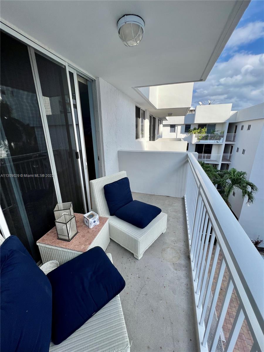 1665 Bay Road, Unit 517 Miami Beach, FL 33139 - Photo 24 of 26 a living room with furniture and a table