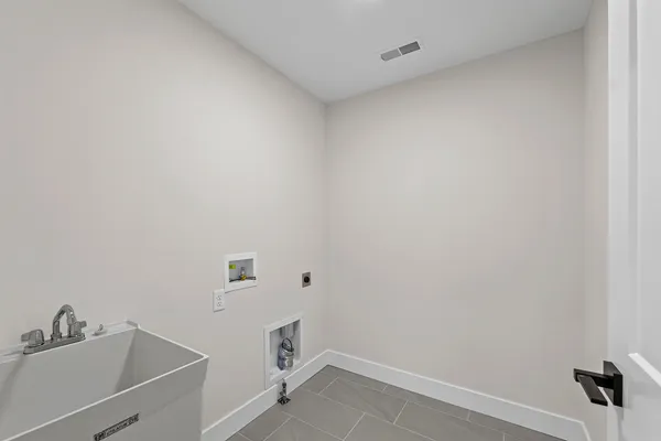 a bathroom with a sink and vanity