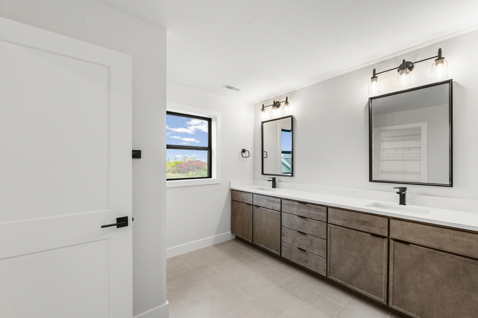 407 Harpers Ferry Savoy, IL 61874 - Photo 23 of 31 a bathroom with 2 sink tub and a mirror