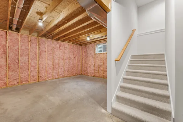 a view of an empty room with stairs