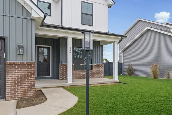 front view of a house with a yard