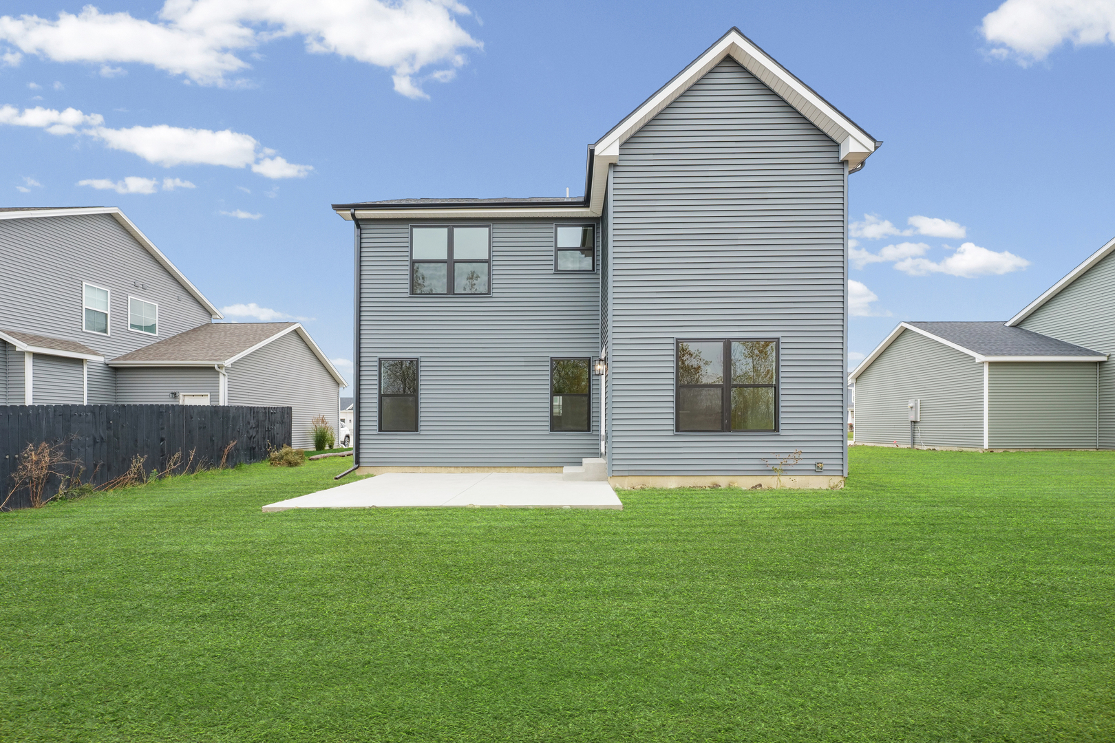 407 Harpers Ferry Savoy, IL 61874 - Photo 31 of 31 a front view of house with yard and garage