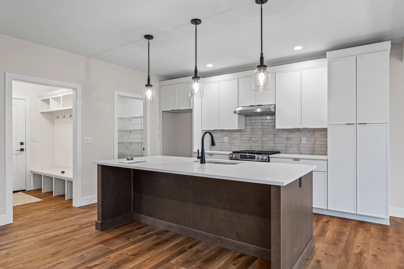 407 Harpers Ferry Savoy, IL 61874 - Photo 8 of 31 a kitchen with kitchen island a sink stainless steel appliances and cabinets