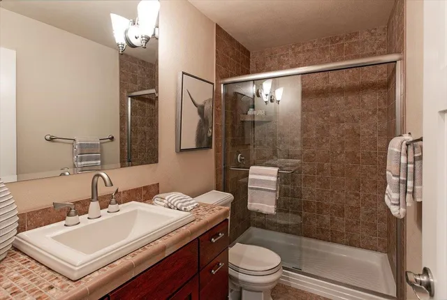 a bedroom with a bed and a dresser