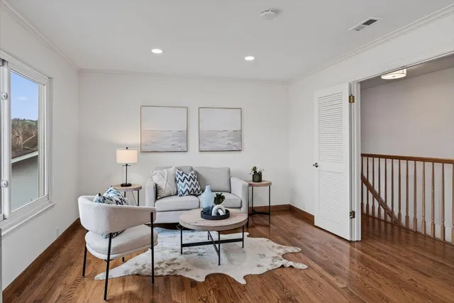 a bathroom with a sink double vanity mirror and a shower