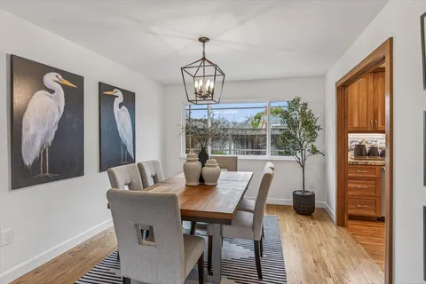 a view of a dining room with furniture window and outside view
