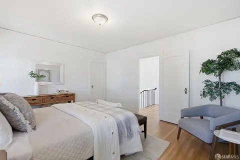a bedroom with a bed and a table in it