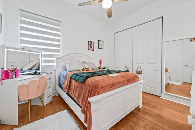 a bedroom with a bed and a dresser