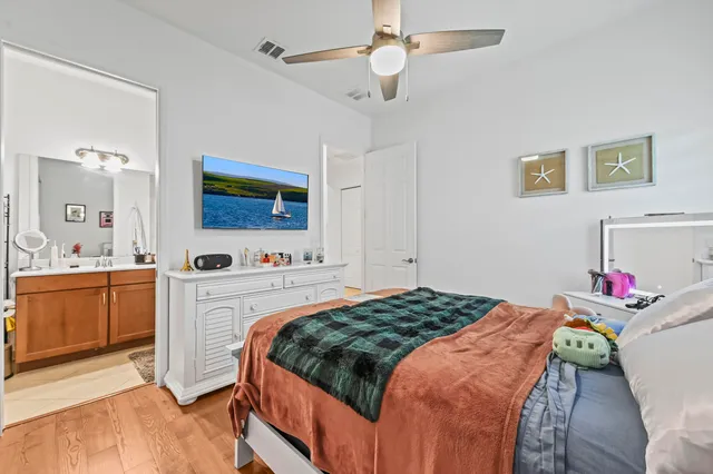a room with a sink cabinets and appliances