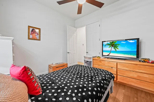 a bedroom with bed and a window