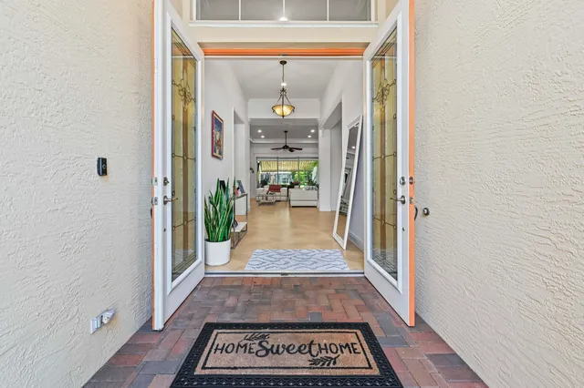 a view of an empty room with a fireplace and a window