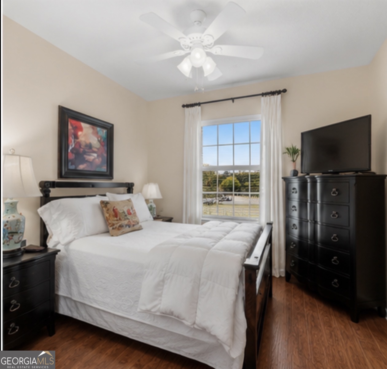 138 Brookfair Lane Leesburg, GA 31763 - Photo 16 of 30 a bedroom with a bed and a flat screen tv
