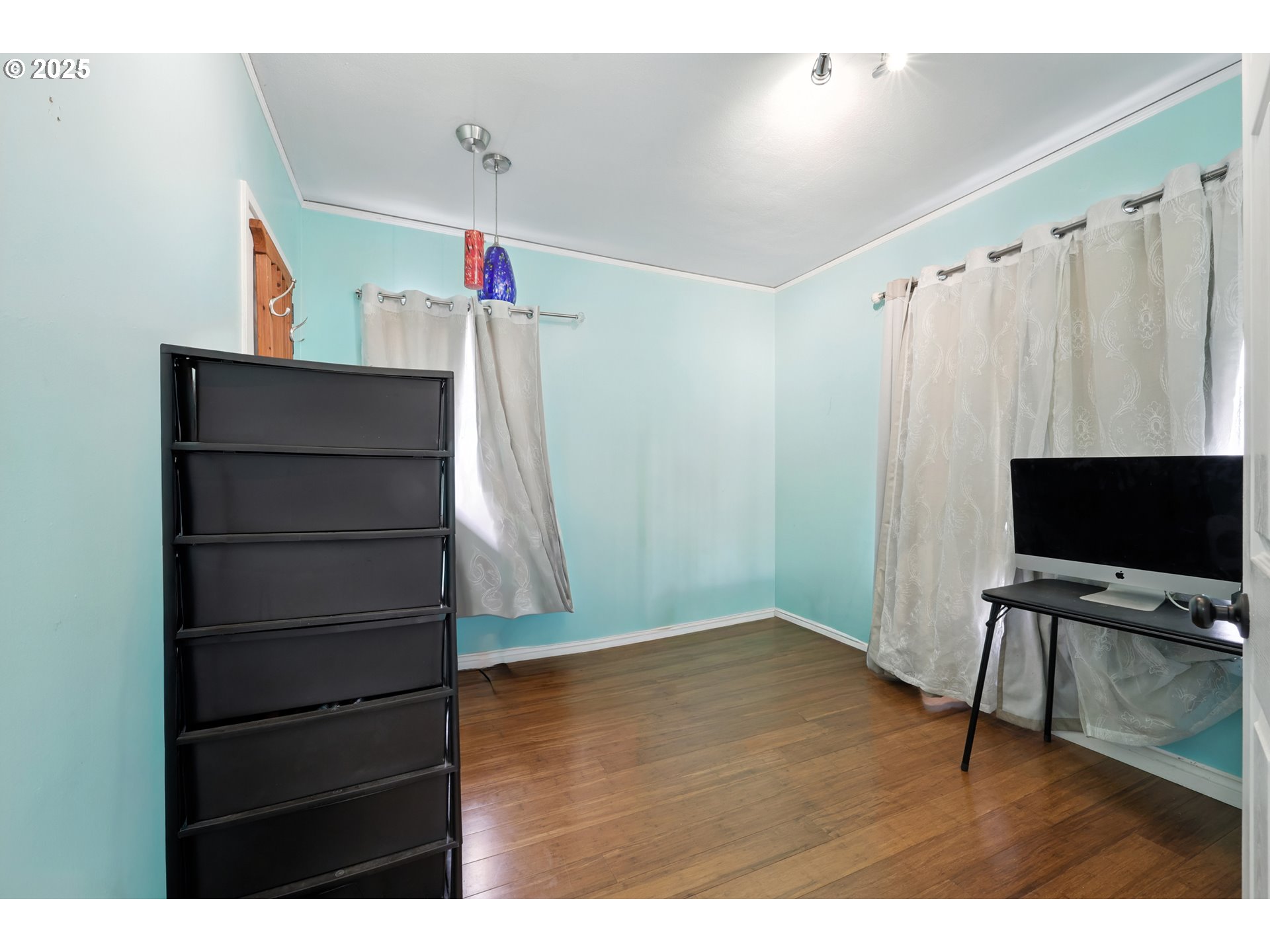 1611 Northeast 102nd Avenue Portland, OR 97220 - Photo 11 of 30 a view of a room with wooden floor and windows