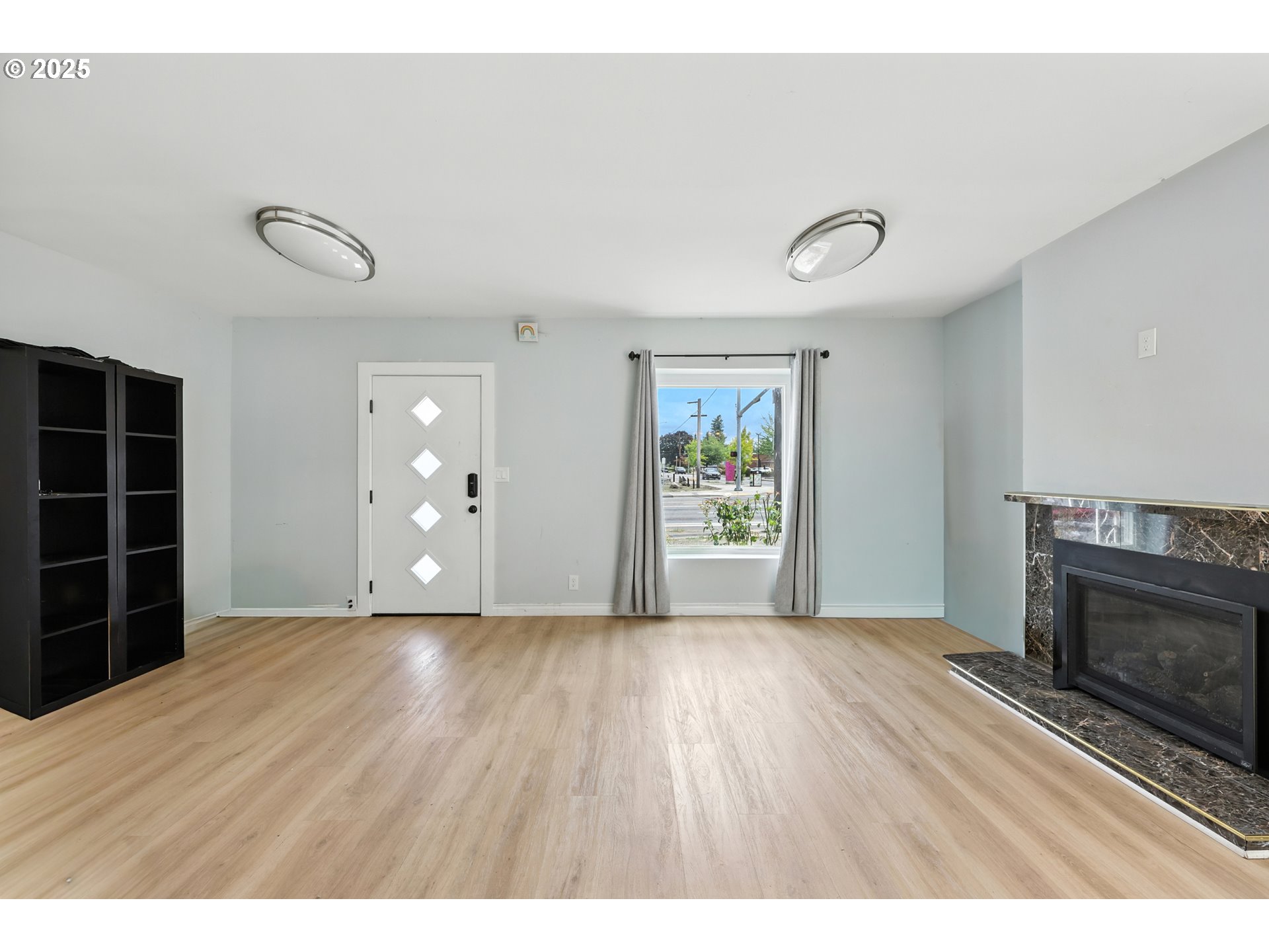 1611 Northeast 102nd Avenue Portland, OR 97220 - Photo 9 of 30 a view of empty room with wooden floor and fan