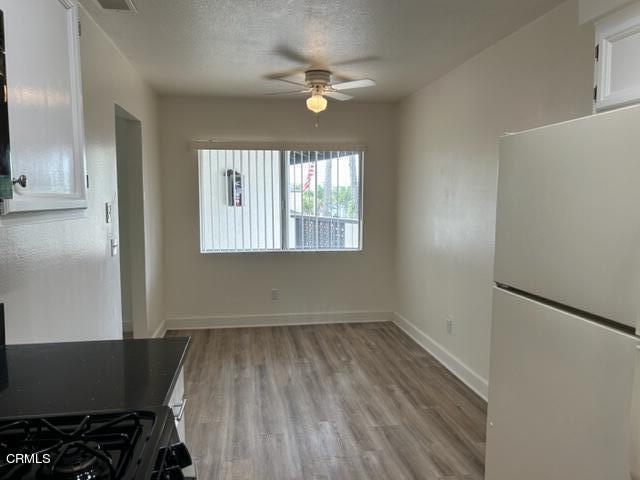 4907 Dunes Street, Unit 7 Oxnard, CA 93035 - Photo 16 of 74 wooden floor in an empty room with a window
