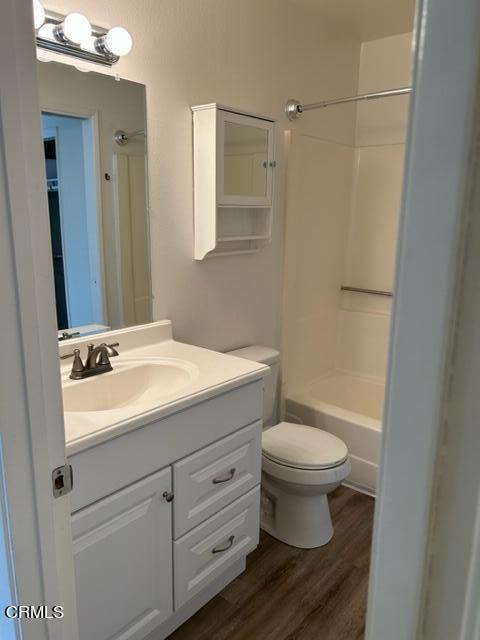 4907 Dunes Street, Unit 7 Oxnard, CA 93035 - Photo 30 of 74 a bathroom with a sink toilet and a mirror