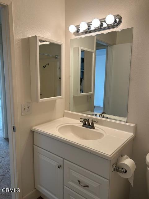 4907 Dunes Street, Unit 7 Oxnard, CA 93035 - Photo 32 of 74 a bathroom with a sink and a mirror