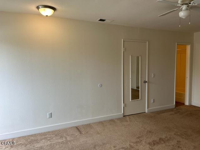 4907 Dunes Street, Unit 7 Oxnard, CA 93035 - Photo 40 of 74 an empty room with a ceiling fan and glass door