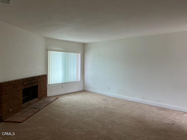 4907 Dunes Street, Unit 7 Oxnard, CA 93035 - Photo 4 of 74 an empty room with a empty space and windows