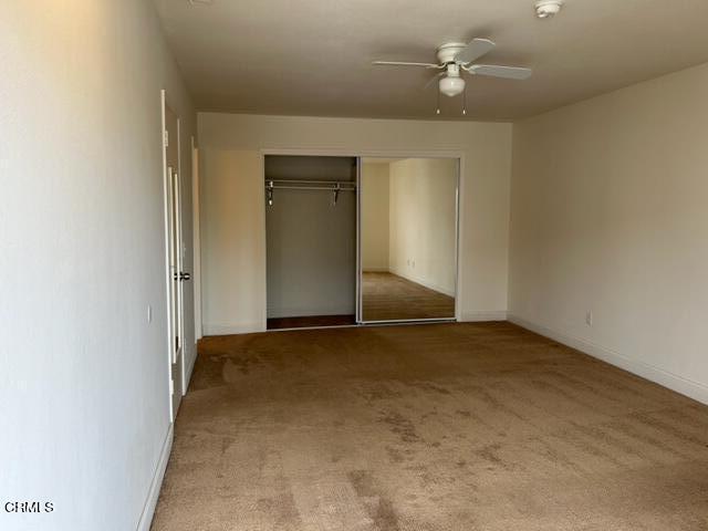 4907 Dunes Street, Unit 7 Oxnard, CA 93035 - Photo 42 of 74 an empty room with a empty space and a ceiling fan