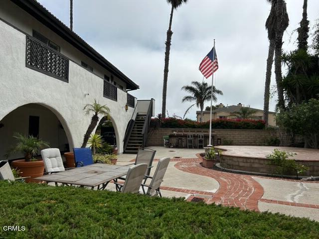 4907 Dunes Street, Unit 7 Oxnard, CA 93035 - Photo 55 of 74 a front view of a house with garden
