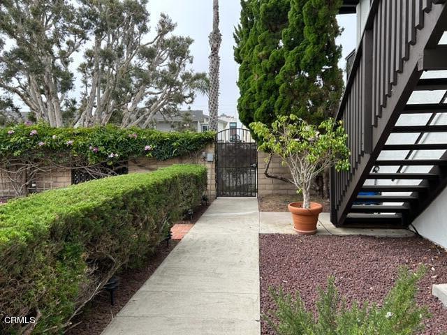 4907 Dunes Street, Unit 7 Oxnard, CA 93035 - Photo 57 of 74 a view of a garden with potted plants and large trees