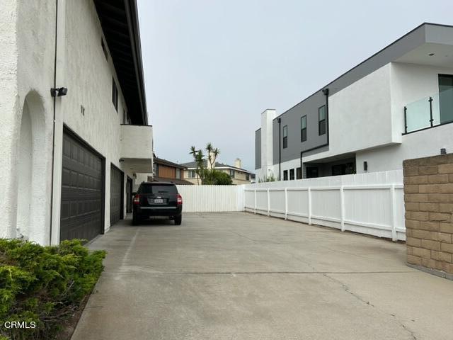 4907 Dunes Street, Unit 7 Oxnard, CA 93035 - Photo 66 of 74 a view of living room that has a fireplace and a large window