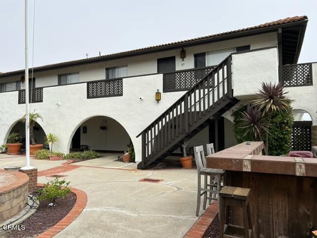 4907 Dunes Street, Unit 7 Oxnard, CA 93035 - Photo 68 of 74 a view of a house with pool and sitting area