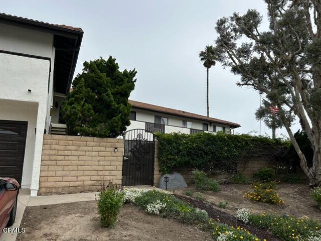 4907 Dunes Street, Unit 7 Oxnard, CA 93035 - Photo 71 of 74 a view of a house with a yard and tree s