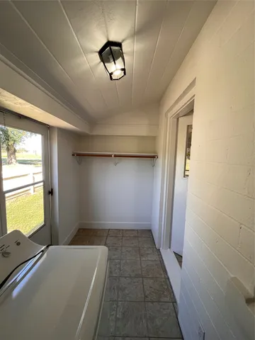 a view of empty room with windows