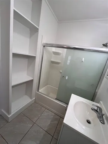 a bathroom with a tub and sink