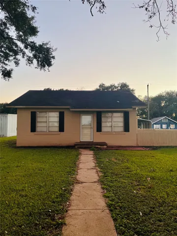 a front view of a house with yard