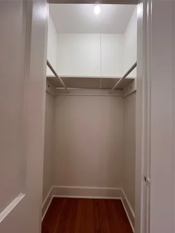 a view of an empty walk in closet